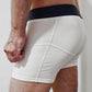 confident male's white underwear short boxer briefs with navy band and dribble guard technology wicking layers for men who suffer from benign prostatic hyperplasia or bph